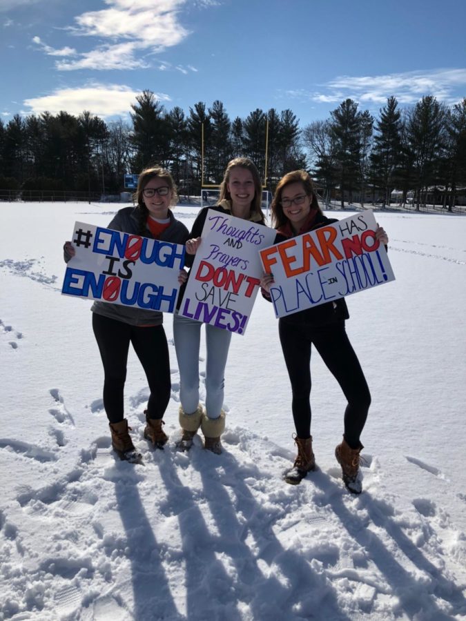 Abby Rossini, Julia Weiner, and Emma Henderson protest during the walk-out