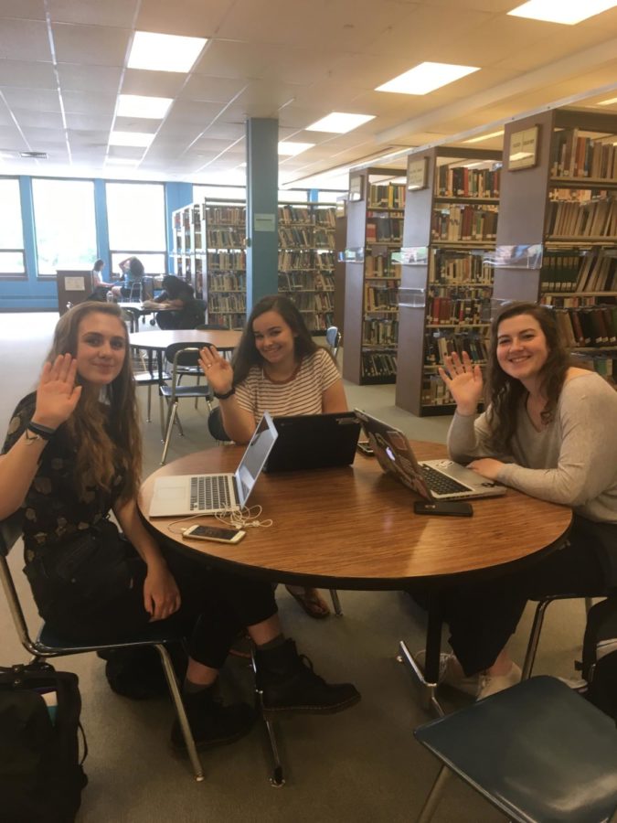 Senior Miranda Mertes (pictured left) Senior Hannah Pliskin (Pictured center) and Senior Mary Grace Harris (Pictured right) sit in the library 4 days before they finish school saying goodbye.