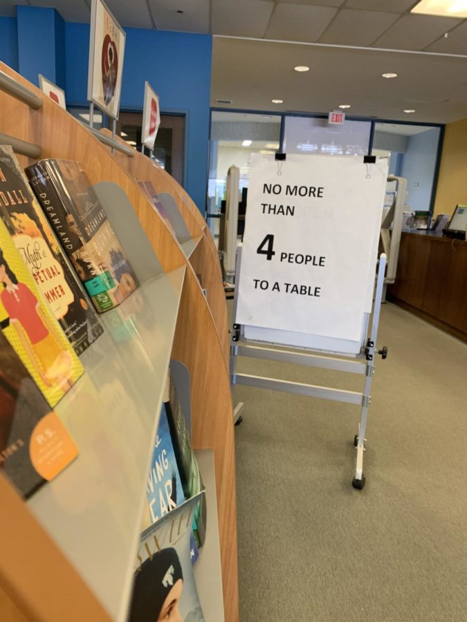 The sign people see in the library that explicitly states the Four Chair Rule.