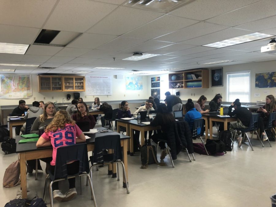 Mr. LaFortes fourth period Honors Earth Science class hard at work on a project.