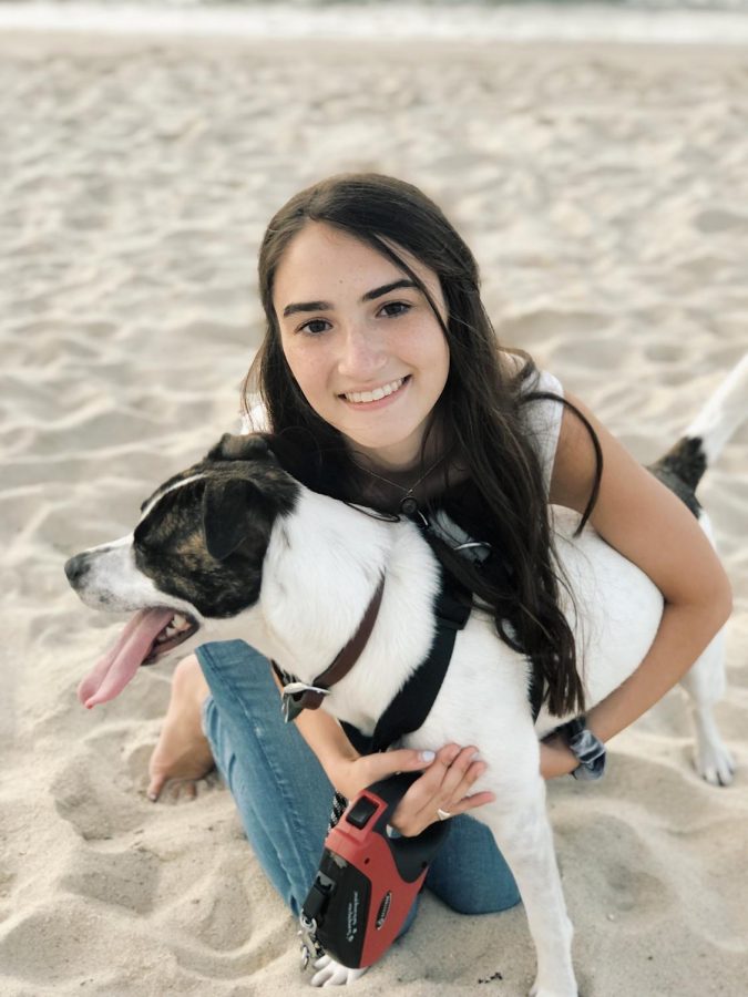 Olivia and her dog, Piper, on vacation. 