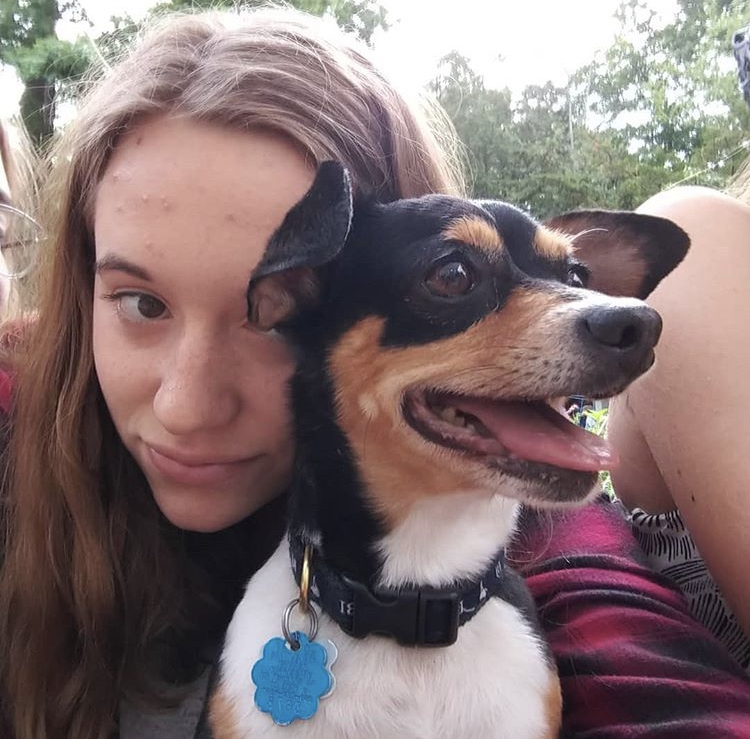 A photo of Emily and her dog, Nanook.