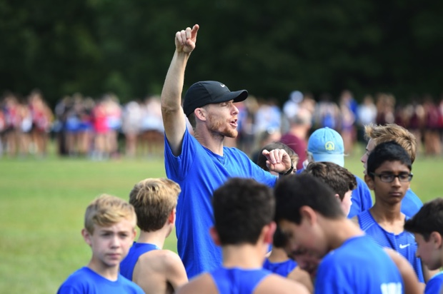 Picture by Thomas Robinson

“Coach Billing giving his motivational pre meet speech as the athletes get ready to run”

