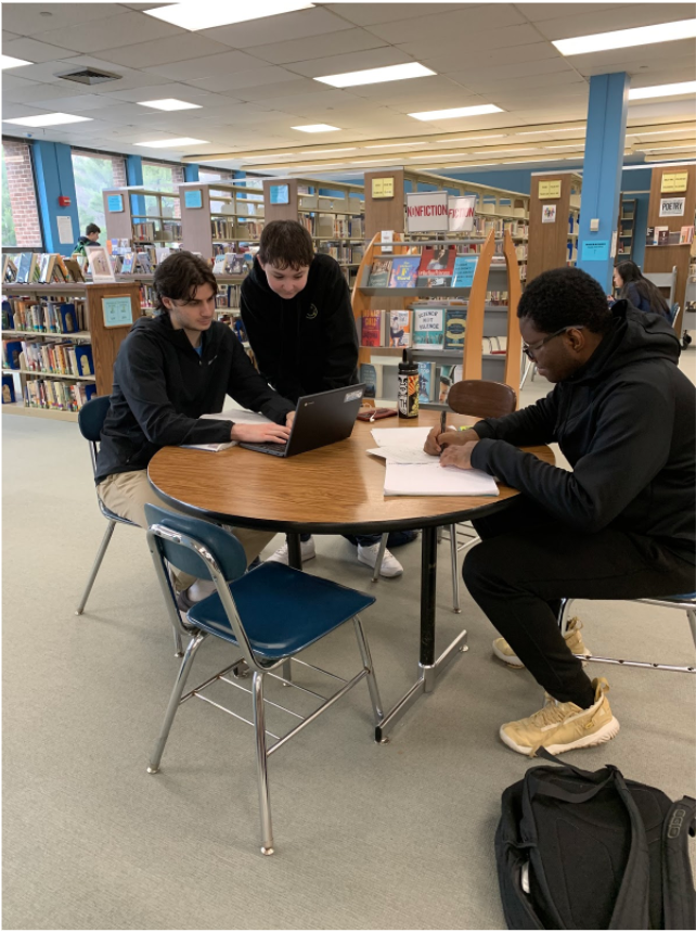 This photo was taken by Sami Farber in the Hall High School Library where students are seen working really hard on their homework. 
