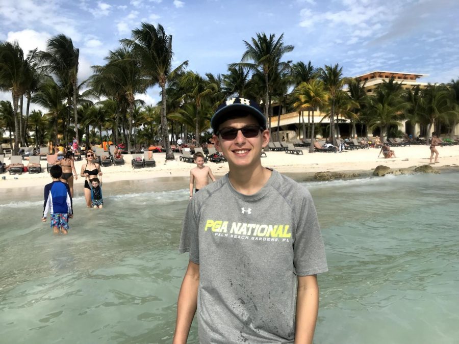 Zach wades in the ocean of Quintana Roo, Mexico in 2018.