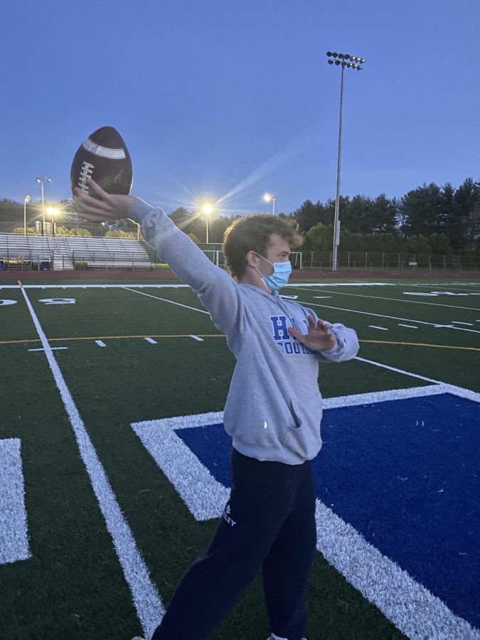 Hall High School Varsity Quarterback Brooks McConnell practicing with his mask on following CDC guidelines 