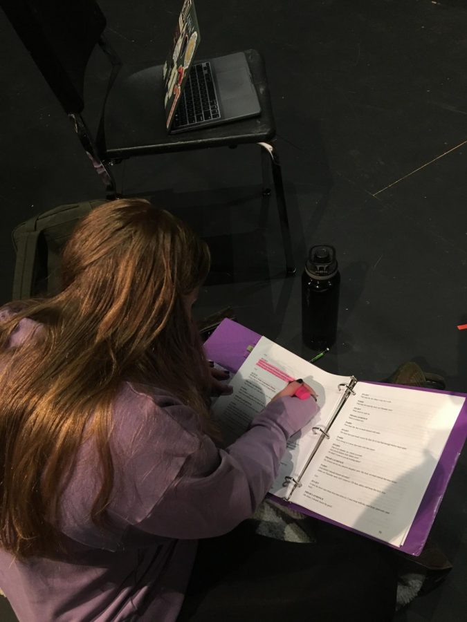 Kate Sorensen, a senior at Hall High school, memorizes her lines for Juliet before she rehearses in the next scene. 