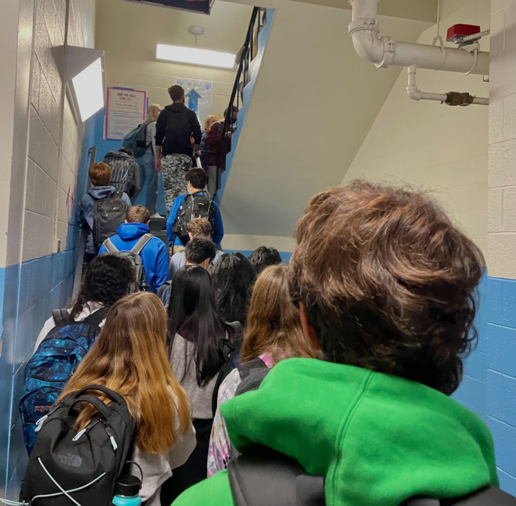 A high volume of students try to make their way up the staircase during passing periods, but are unable to move, causing them to be late to class and receive discipline from their teachers. 