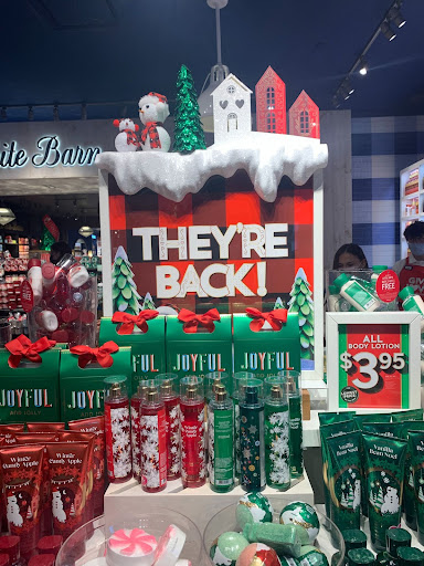 A joyful sign in Bath and Body Works proclaiming the return of the esteemed holiday collection.