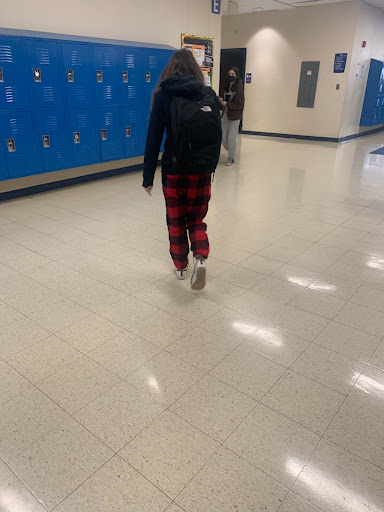 A pajama-clad student roaming the halls.