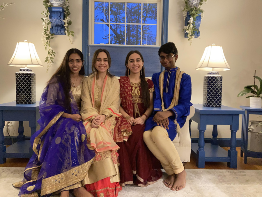 Indian and Nepali students in traditional clothing during a Diwali Party