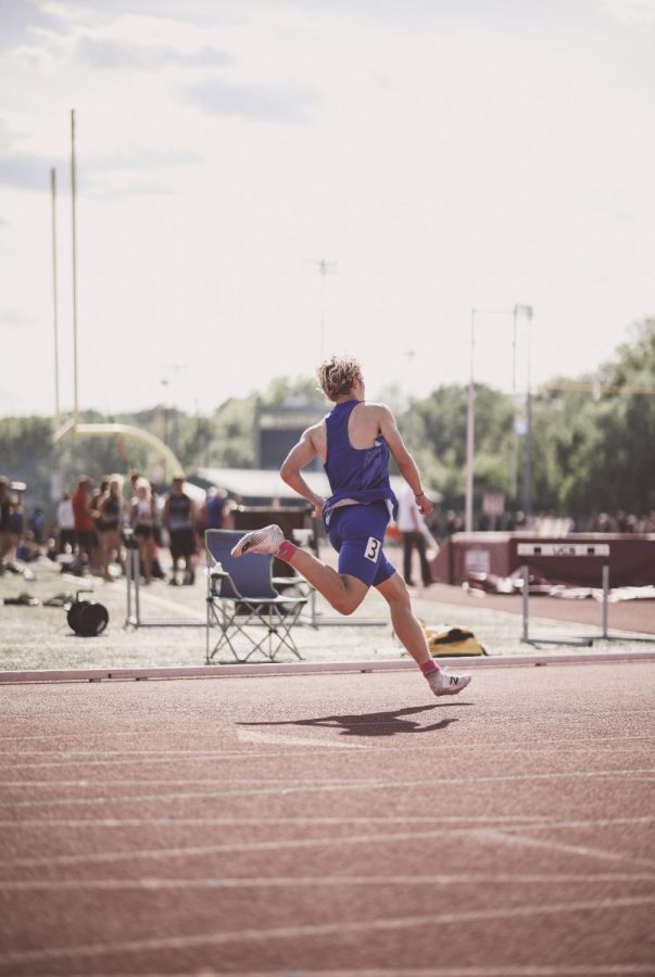 Sam competes at the New England Championship 400 Meter race.