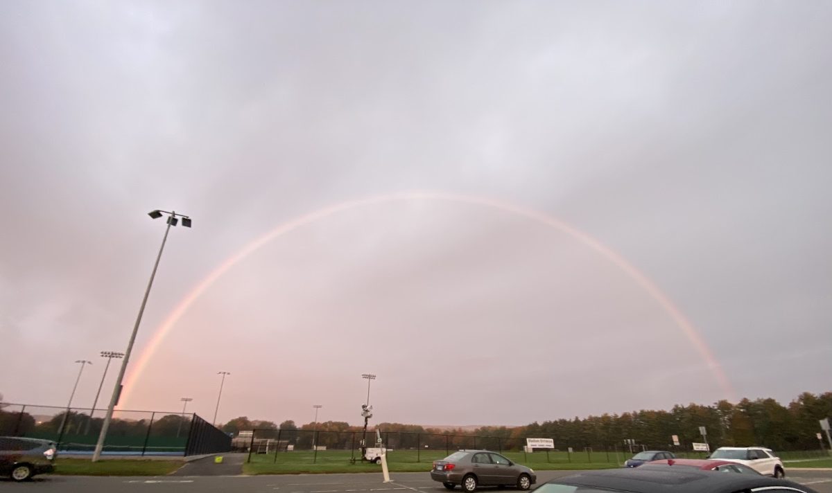 A rainbow caught in the 0.5 lens of an Iphone camera, early in the morning on Friday October 20th, 2023, in the Hall High School parking lot. 
