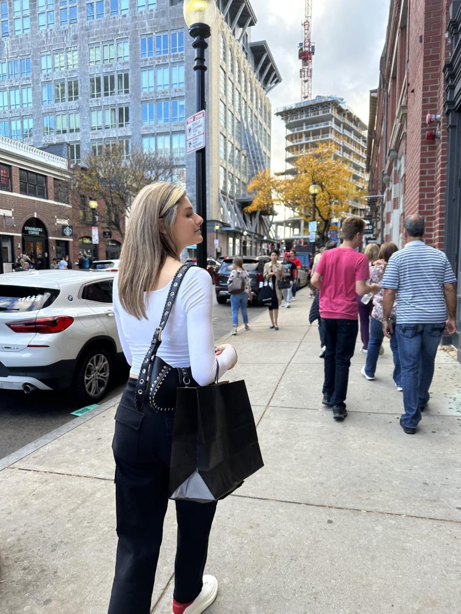 Hall student Sienna walking in Boston