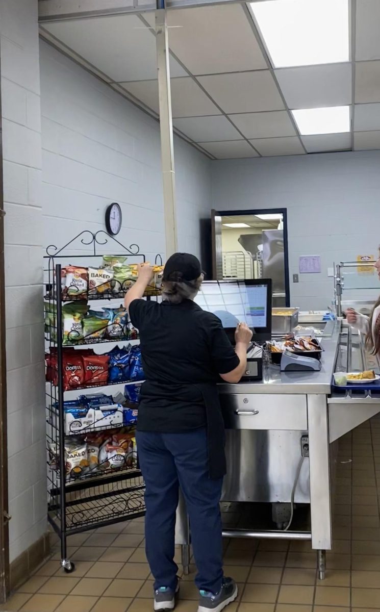 The picture shows the cafeteria only selling chips during lunch periods.   Snack money is charged in addition to the $3.50 fixed lunch. Meanwhile, the vending machines are closed, so students must buy snacks from the cafeteria. 