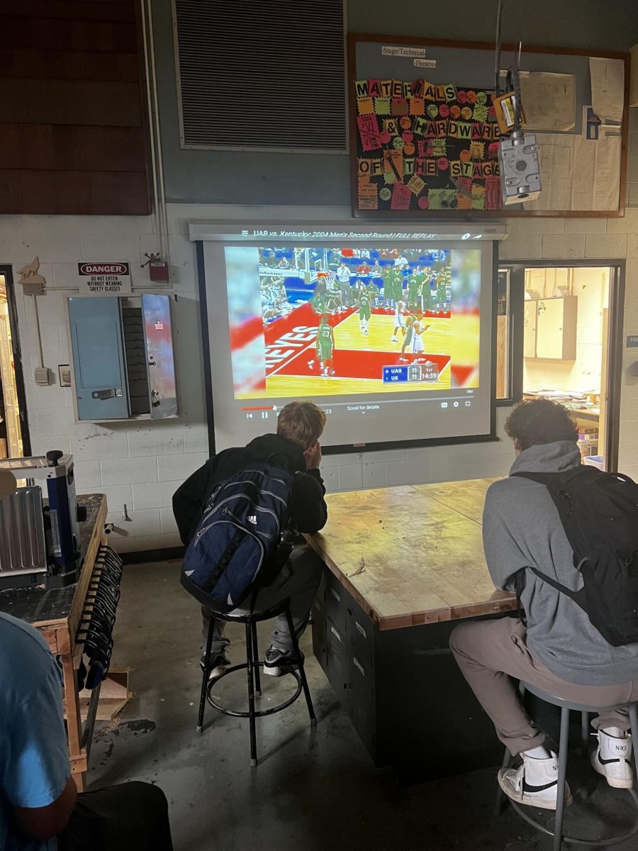 Students re- watch their favorite march madness moments during some downtime in a class. Many people are in anticipation for the upcoming March Madness

