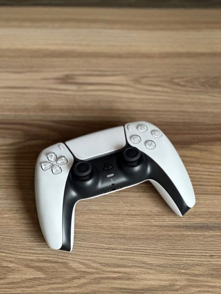 Playstation 5 controller on wood table