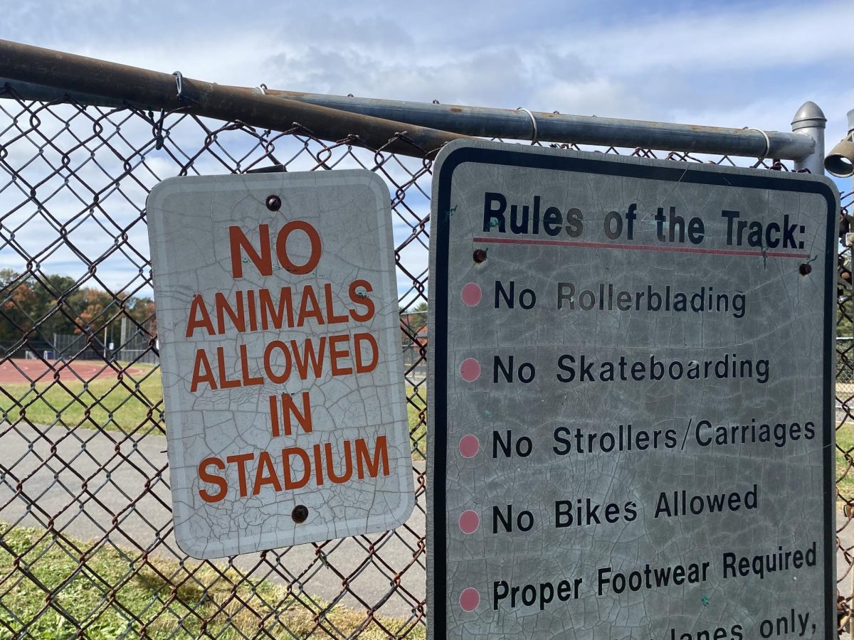 Signage barring pets from entering Hall's track and football field. 