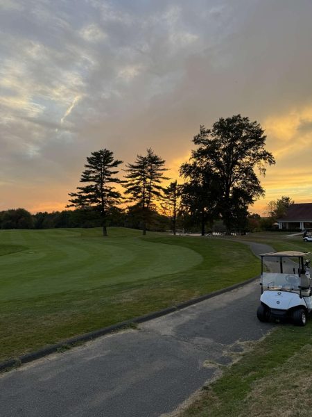 A beautiful view of the fairway on the 18th hole at sunset.