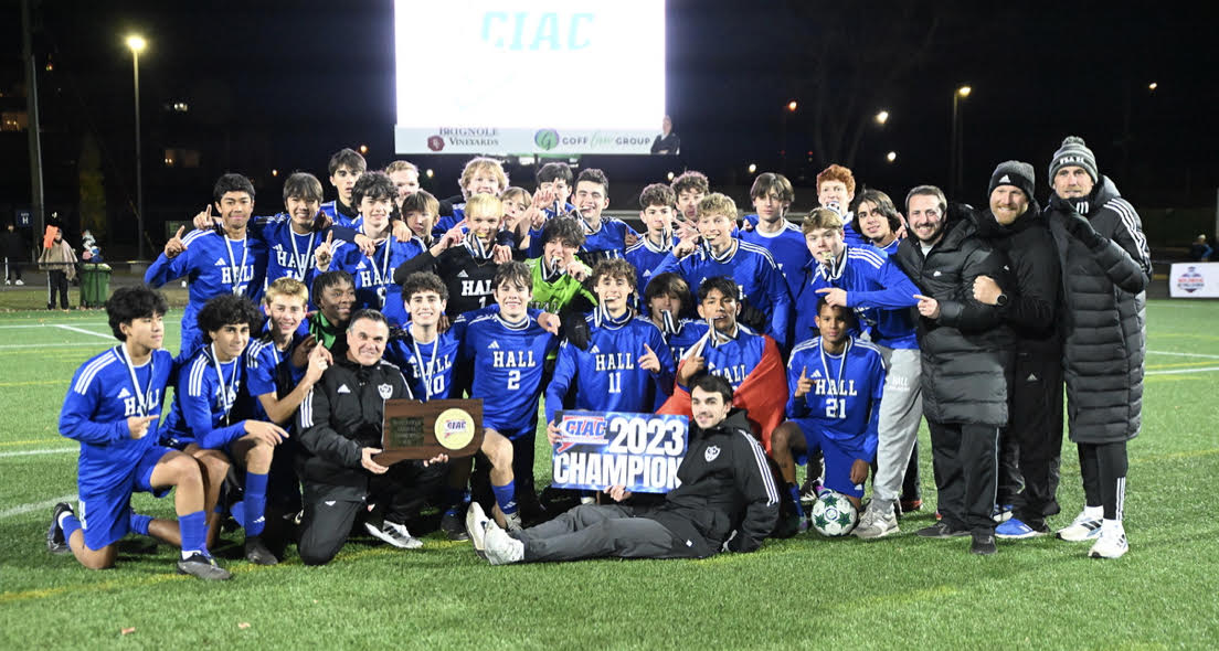 Hall poses for a team photo after their State Championship win in November of 2023. 