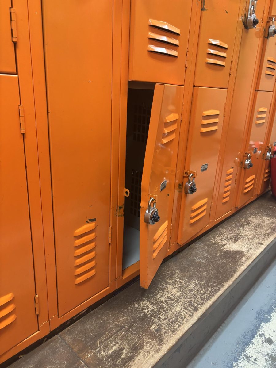 One of the many badly dented lockers in the girls' locker room that refuse to close