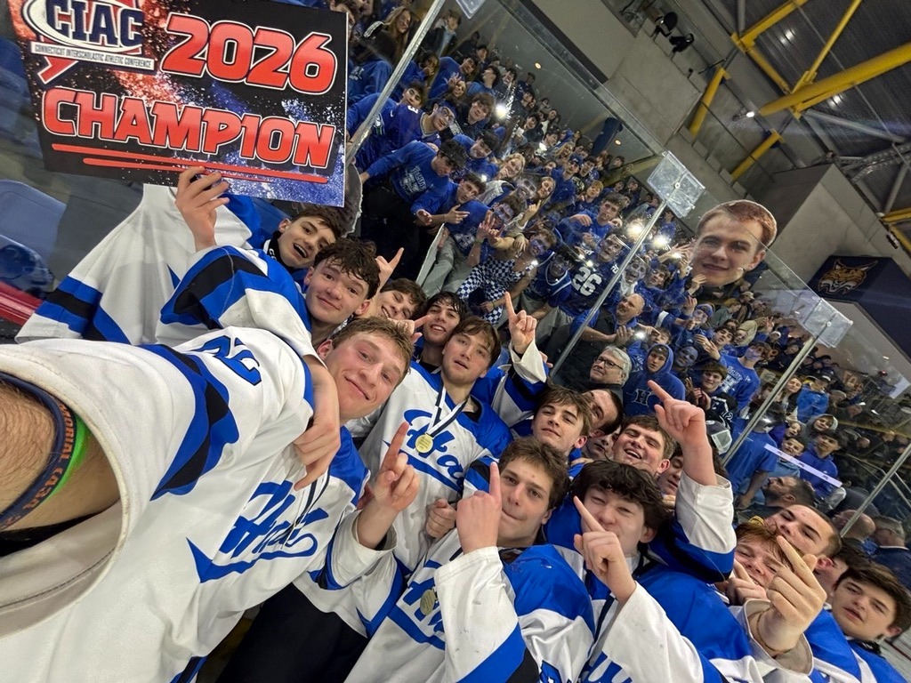 The Hall Hockey Team takes a selfie with the student section at Quinnipiac after winning the state championship in OT against E.O. Smith, 2-1.
