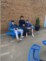 Students relax on a warm April 1st in the courtyard
