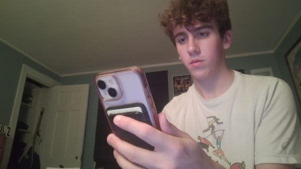 A high school Senior scrolls before going to bed.